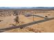 Aerial view of a single-story home on a large lot with mountain views at 53259 W Barn Owl Rd, Maricopa, AZ 85139