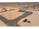 New manufactured home on a large desert lot with water tanks at 53259 W Barn Owl Rd, Maricopa, AZ 85139