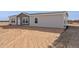 Side view of a manufactured home on a large lot in the desert at 53259 W Barn Owl Rd, Maricopa, AZ 85139