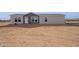 New manufactured home with neutral exterior and desert landscaping at 53259 W Barn Owl Rd, Maricopa, AZ 85139