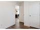 Clean hallway with access to dining area and closet at 53259 W Barn Owl Rd, Maricopa, AZ 85139