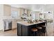 Modern kitchen with island, stainless steel appliances, and ample cabinetry at 53259 W Barn Owl Rd, Maricopa, AZ 85139