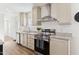 Clean and bright kitchen with stainless steel appliances and light cabinets at 53259 W Barn Owl Rd, Maricopa, AZ 85139