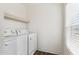 Bright laundry room with washer and dryer hookups at 53259 W Barn Owl Rd, Maricopa, AZ 85139