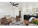 Open concept living room with kitchen and dining area views at 53259 W Barn Owl Rd, Maricopa, AZ 85139