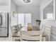 Bright dining room featuring a table with white chairs, and a large mirror at 5341 E Carol Ave, Mesa, AZ 85206