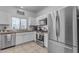 Modern kitchen with stainless steel appliances and white cabinets at 5341 E Carol Ave, Mesa, AZ 85206