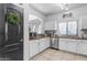 Modern kitchen with stainless steel appliances and white cabinets at 5341 E Carol Ave, Mesa, AZ 85206