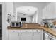 Modern kitchen with stainless steel appliances and white cabinets at 5341 E Carol Ave, Mesa, AZ 85206