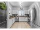 Modern kitchen with stainless steel appliances and white cabinets at 5341 E Carol Ave, Mesa, AZ 85206