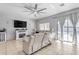 Spacious living room with a fireplace, recessed lighting, and sliding glass doors leading to a patio at 5341 E Carol Ave, Mesa, AZ 85206