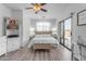 Main bedroom with a king-size bed, a walk-in closet, and access to a balcony at 5341 E Carol Ave, Mesa, AZ 85206