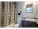 Clean bathroom with shower/tub and dark vanity at 639 W Kingman Loop, Casa Grande, AZ 85122