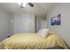 Bedroom with ceiling fan and yellow bedding at 639 W Kingman Loop, Casa Grande, AZ 85122
