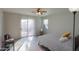 Bedroom with sliding door to backyard, ceiling fan, and gray bedding at 639 W Kingman Loop, Casa Grande, AZ 85122