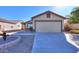 House exterior showcasing a garage and desert landscaping at 639 W Kingman Loop, Casa Grande, AZ 85122