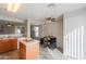 Open kitchen with an island and a breakfast bar at 639 W Kingman Loop, Casa Grande, AZ 85122