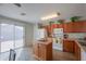 Kitchen boasts an island, wood cabinets, and modern appliances at 639 W Kingman Loop, Casa Grande, AZ 85122