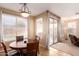 Dining area with a wooden table and sliding glass doors to backyard at 6492 S View Ln, Gilbert, AZ 85298