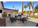 Spacious backyard with pool, patio furniture, and palm trees at 6542 E Ludlow Dr, Scottsdale, AZ 85254