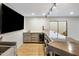 Basement wet bar with countertop and mini-fridge at 6542 E Ludlow Dr, Scottsdale, AZ 85254