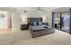 Main bedroom with a king-size bed and private access to backyard at 6542 E Ludlow Dr, Scottsdale, AZ 85254