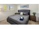 Cozy bedroom with a queen-size bed, nightstands, and window shutters at 6542 E Ludlow Dr, Scottsdale, AZ 85254