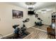 Home gym with exercise bike, mirror and hardwood floors at 6542 E Ludlow Dr, Scottsdale, AZ 85254