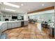 Open kitchen with breakfast bar and views into living room at 6542 E Ludlow Dr, Scottsdale, AZ 85254