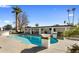 Inviting pool with spacious patio and palm trees at 6542 E Ludlow Dr, Scottsdale, AZ 85254