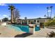 Kidney-shaped pool with fire bowls and patio at 6542 E Ludlow Dr, Scottsdale, AZ 85254