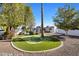 Landscaped backyard putting green surrounded by trees at 6542 E Ludlow Dr, Scottsdale, AZ 85254