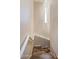 Clean staircase with wood flooring and modern chandelier at 6542 E Ludlow Dr, Scottsdale, AZ 85254