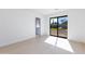 Bedroom with hardwood floors, sliding glass doors and en-suite bathroom at 6759 E Aire Libre Ln, Scottsdale, AZ 85254