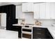 Detailed shot of the kitchen with custom cabinetry, modern appliances, and stylish countertop decor at 6759 E Aire Libre Ln, Scottsdale, AZ 85254