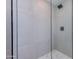 Clean shower with white hexagonal floor tiles and glass enclosure at 6759 E Aire Libre Ln, Scottsdale, AZ 85254