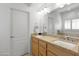 Double vanity bathroom with granite countertop at 6940 E Cochise Rd # 1011, Paradise Valley, AZ 85253