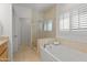 Spa-like bathroom with walk-in shower and soaking tub at 6940 E Cochise Rd # 1011, Paradise Valley, AZ 85253