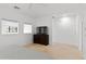 Bright bedroom with dresser, TV, and large windows at 6940 E Cochise Rd # 1011, Paradise Valley, AZ 85253