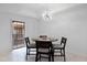 Modern dining area with balcony access and chandelier at 6940 E Cochise Rd # 1011, Paradise Valley, AZ 85253