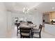 Dining area with a table and chairs near the kitchen at 6940 E Cochise Rd # 1011, Paradise Valley, AZ 85253