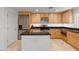 Modern kitchen with stainless steel appliances and granite countertops at 6940 E Cochise Rd # 1011, Paradise Valley, AZ 85253