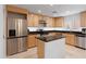 Updated kitchen featuring stainless steel appliances and granite island at 6940 E Cochise Rd # 1011, Paradise Valley, AZ 85253
