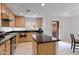 Well-equipped kitchen with island and stainless steel appliances at 6940 E Cochise Rd # 1011, Paradise Valley, AZ 85253