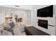 Spacious living room with fireplace and built-in shelving at 6940 E Cochise Rd # 1011, Paradise Valley, AZ 85253