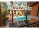Inviting community pool with palm trees and lounge chairs at 6940 E Cochise Rd # 1011, Paradise Valley, AZ 85253