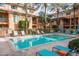 Inviting community pool with lounge chairs and spa at 6940 E Cochise Rd # 1011, Paradise Valley, AZ 85253