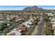 Aerial view highlighting the home and pool with mountain view at 7238 E Solano Dr, Scottsdale, AZ 85250