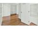 White hallway closet with built-in shelves and rod at 7238 E Solano Dr, Scottsdale, AZ 85250