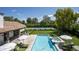 Aerial view showing pool, spa, tennis courts, and house at 7305 E Royal Palm Rd, Scottsdale, AZ 85258